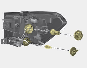 Kia Carnival: Rear combination lamp bulb replacement. 4. Remove the socket from the assembly by turning the socket counterclockwise